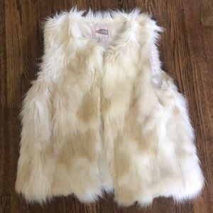 White fur vest